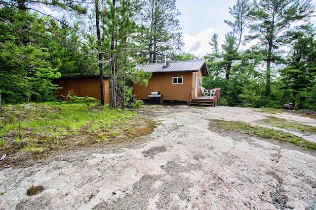 4194 First Lake Rd, Ely, MN 55731 - view of side of property featuring a deck and a metal roof