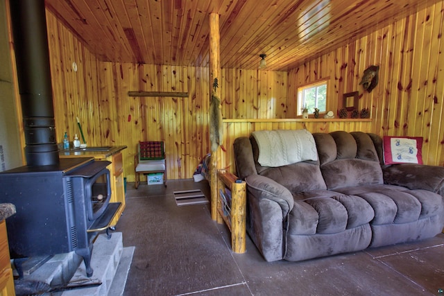 4194 First Lake Rd, Ely, MN 55731 - living room featuring a wood stove, wood walls, and wooden ceiling