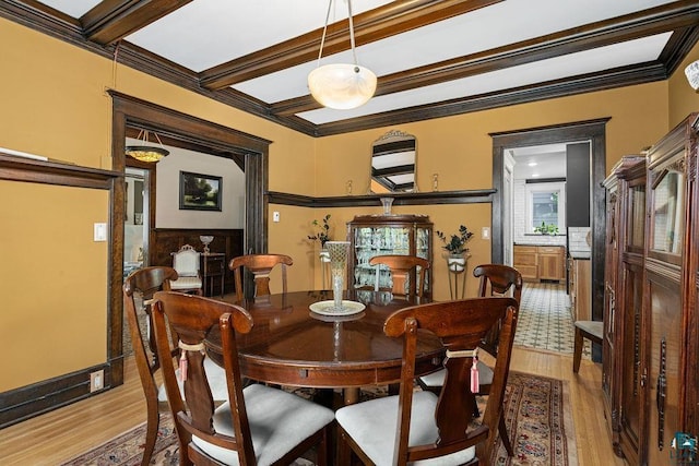 2319 E 4th St, Duluth, MN 55812 - dining room with light wood finished floors, crown molding, and beam ceiling