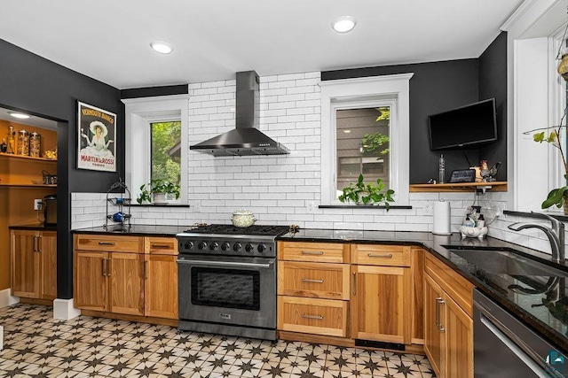 2319 E 4th St, Duluth, MN 55812 - kitchen with stainless steel appliances, wall chimney range hood, open shelves, light flooring, and backsplash
