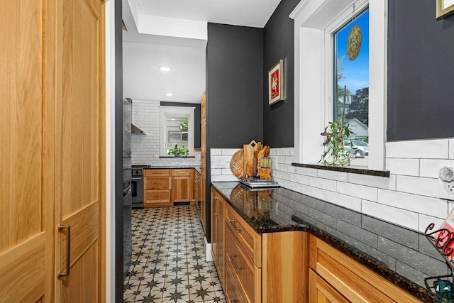 2319 E 4th St, Duluth, MN 55812 - bar featuring light floors, decorative backsplash, stove, and wall chimney range hood