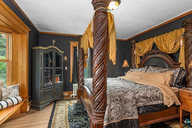 2319 E 4th St, Duluth, MN 55812 - bedroom featuring wood finished floors and crown molding