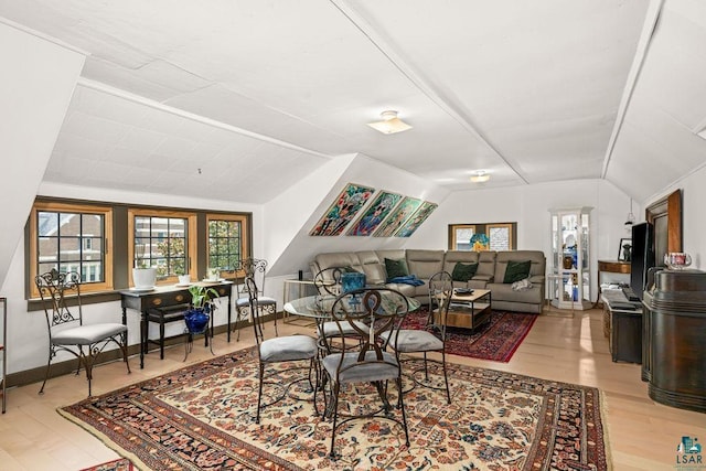 2319 E 4th St, Duluth, MN 55812 - dining space featuring vaulted ceiling and light wood-type flooring