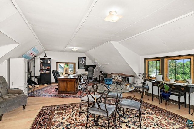 2319 E 4th St, Duluth, MN 55812 - dining room featuring vaulted ceiling, a desk, and wood finished floors
