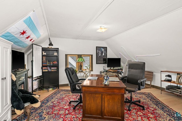 2319 E 4th St, Duluth, MN 55812 - home office featuring lofted ceiling and light wood-style flooring