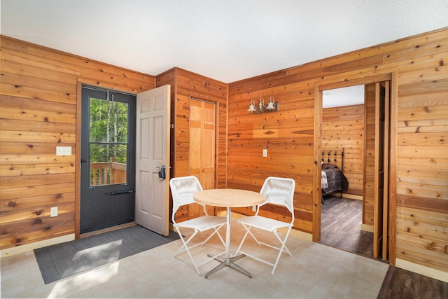 1612 Pequaywan Lake Rd, Ault, MN 55602 - dining room featuring wood walls and wood finished floors