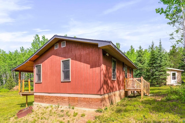 1612 Pequaywan Lake Rd, Ault, MN 55602 - view of side of property featuring a wooden deck