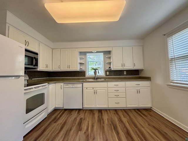 35 E Faribault St, Duluth, MN 55803 - kitchen with white appliances, open shelves, dark countertops, and dark wood-type flooring
