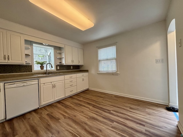 35 E Faribault St, Duluth, MN 55803 - kitchen with white dishwasher, open shelves, dark countertops, and dark wood-type flooring