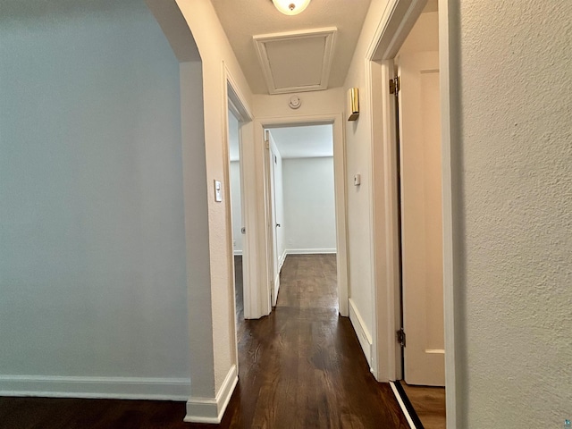 35 E Faribault St, Duluth, MN 55803 - corridor featuring dark wood finished floors, a textured wall, and arched walkways