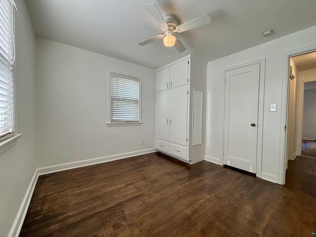 35 E Faribault St, Duluth, MN 55803 - unfurnished bedroom featuring dark wood finished floors and ceiling fan