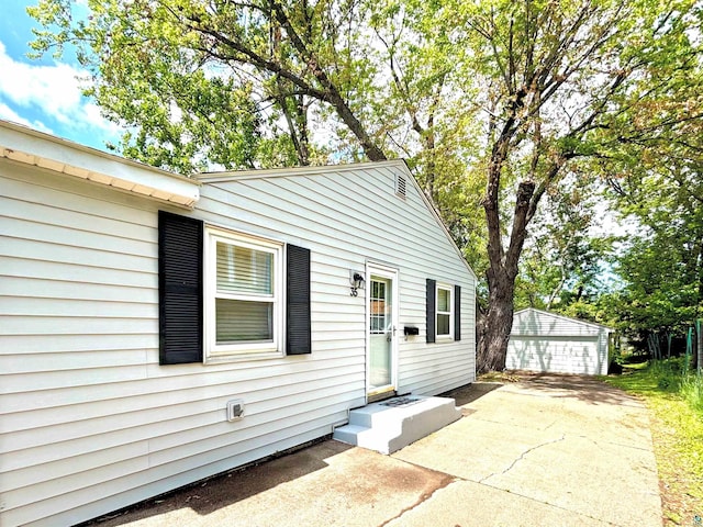 35 E Faribault St, Duluth, MN 55803 - view of front of house featuring a garage and an outbuilding