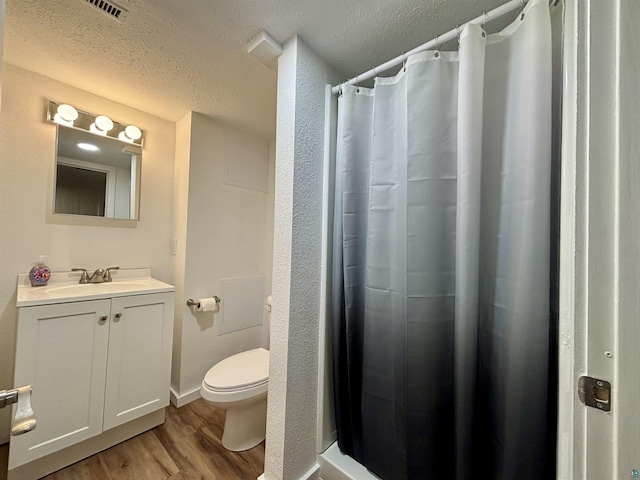 35 E Faribault St, Duluth, MN 55803 - full bath with wood finished floors, vanity, a textured ceiling, and a shower with shower curtain