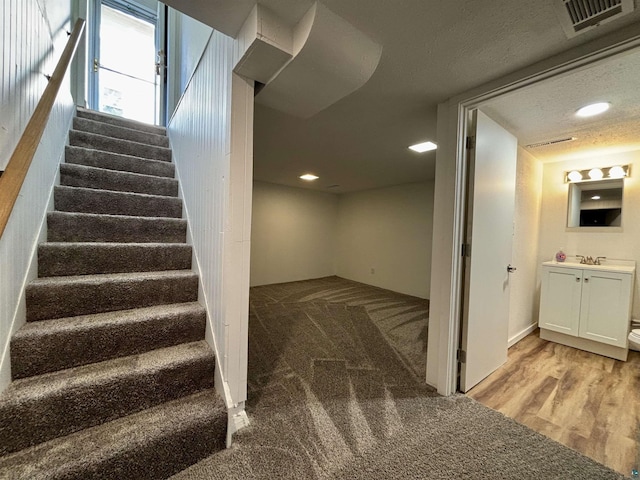 35 E Faribault St, Duluth, MN 55803 - staircase with recessed lighting, wood finished floors, and carpet