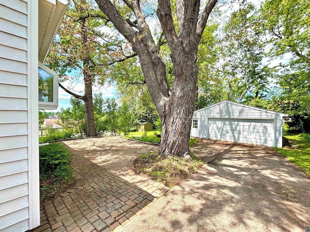 35 E Faribault St, Duluth, MN 55803 - view of patio with a detached garage and an outbuilding