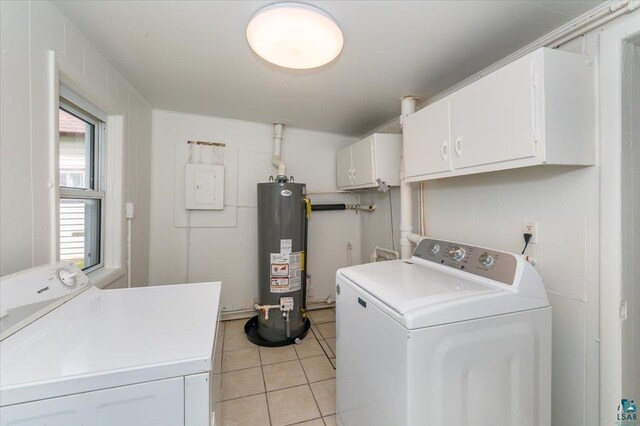 3731 W 2nd St, Duluth, MN 55807 - laundry area with gas water heater, washer and clothes dryer, light tile patterned flooring, cabinet space, and electric panel