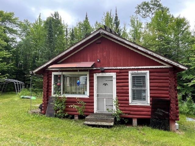 2217 Michael Beach Rd, Zim, MN 55738 - log cabin with log exterior and a front lawn