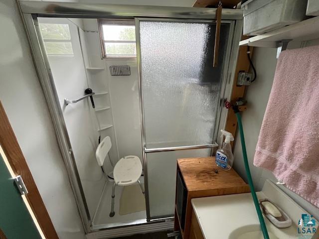2217 Michael Beach Rd, Zim, MN 55738 - bathroom featuring a stall shower