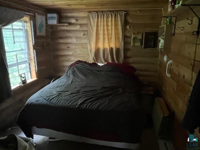 2217 Michael Beach Rd, Zim, MN 55738 - bedroom featuring log walls, multiple windows, and wood ceiling