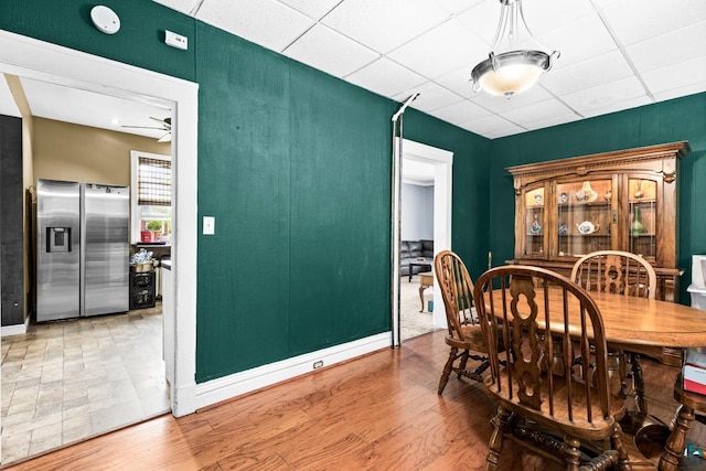 3801 W 5th St, Duluth, MN 55807 - dining room with a drop ceiling, ceiling fan, and wood finished floors