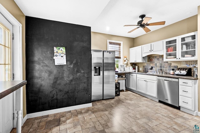 3801 W 5th St, Duluth, MN 55807 - kitchen with appliances with stainless steel finishes, ceiling fan, glass insert cabinets, and white cabinets
