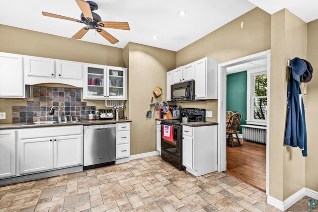 3801 W 5th St, Duluth, MN 55807 - kitchen featuring black appliances, decorative backsplash, stone tile flooring, white cabinets, and recessed lighting