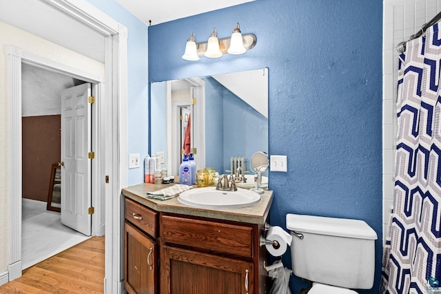 3801 W 5th St, Duluth, MN 55807 - bathroom with vanity, wood finished floors, a textured wall, and a shower with curtain