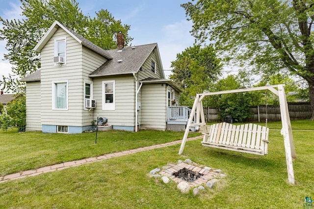 3801 W 5th St, Duluth, MN 55807 - back of house featuring a shingled roof, a chimney, a deck, cooling unit, and an outdoor fire pit