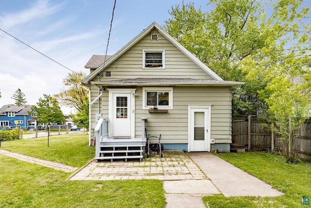 3801 W 5th St, Duluth, MN 55807 - back of house featuring a patio and roof with shingles