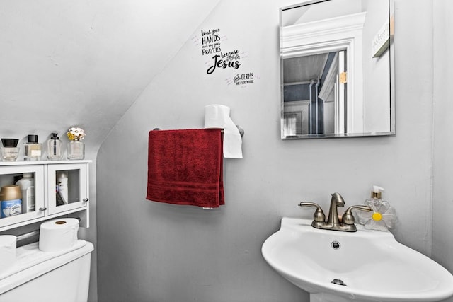 3801 W 5th St, Duluth, MN 55807 - half bathroom with a sink and lofted ceiling