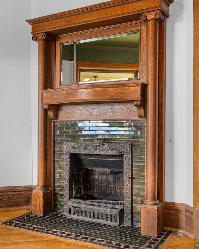 31 W 5th St, Duluth, MN 55806 - detailed view of a fireplace with flush hearth and wood finished floors