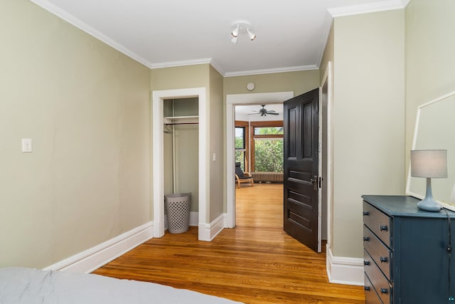 31 W 5th St, Duluth, MN 55806 - bedroom featuring wood finished floors, crown molding, and a closet