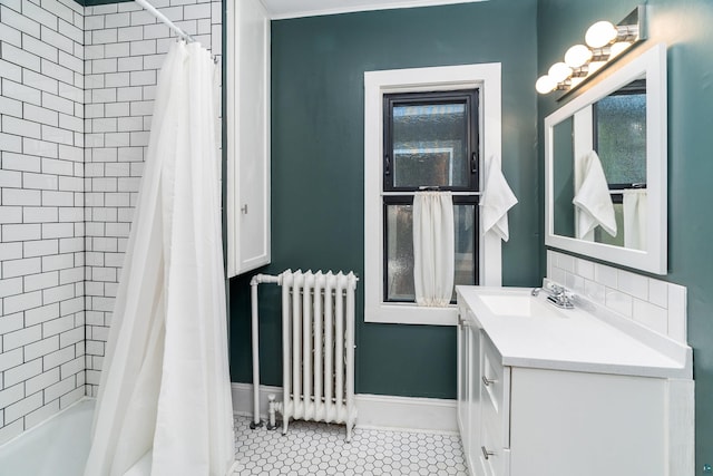 31 W 5th St, Duluth, MN 55806 - bathroom featuring radiator, vanity, tile patterned floors, and shower / tub combo with curtain