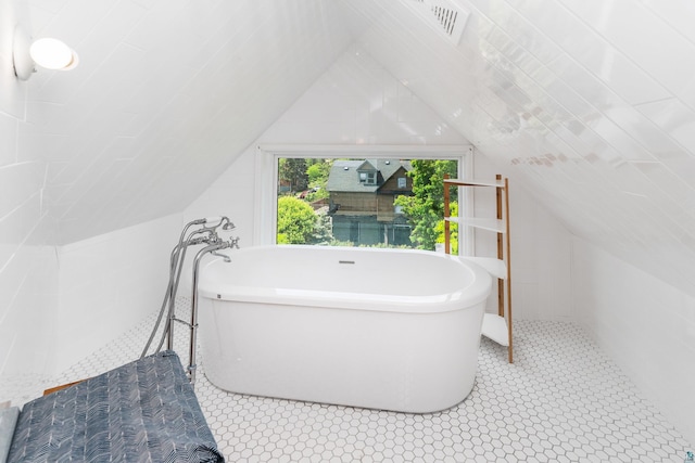 31 W 5th St, Duluth, MN 55806 - bathroom with a freestanding bath and lofted ceiling
