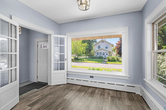 996 85th Ave W, Duluth, MN 55808 - entryway featuring baseboard heating, healthy amount of natural light, and wood finished floors