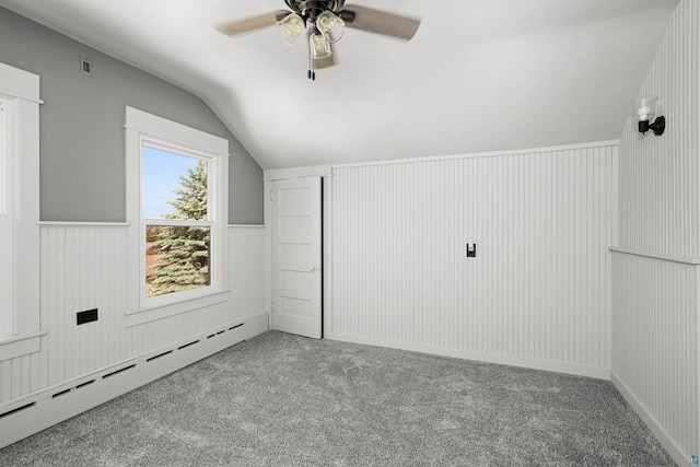 996 85th Ave W, Duluth, MN 55808 - additional living space featuring a baseboard heating unit, lofted ceiling, carpet flooring, a ceiling fan, and wainscoting