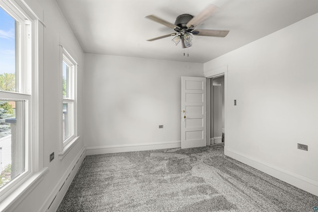 996 85th Ave W, Duluth, MN 55808 - empty room with ceiling fan, carpet, and a baseboard heating unit