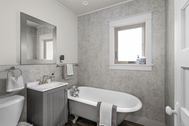 996 85th Ave W, Duluth, MN 55808 - full bath with ornamental molding, a soaking tub, plenty of natural light, vanity, and wood finished floors