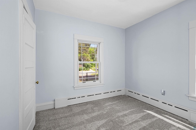 996 85th Ave W, Duluth, MN 55808 - empty room with carpet flooring and a baseboard heating unit