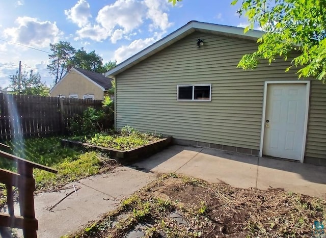 112 W 3rd Ave N, Aurora, MN 55705 - view of side of home with a patio