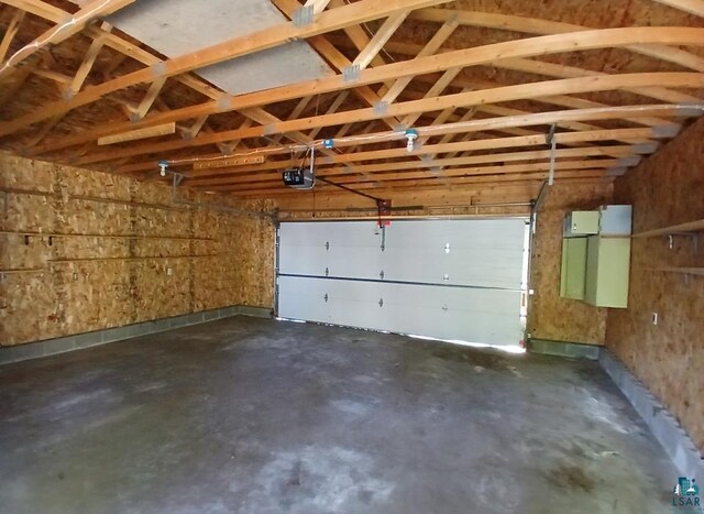 112 W 3rd Ave N, Aurora, MN 55705 - garage featuring a garage door opener