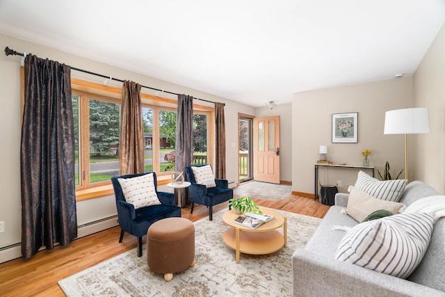 318 Marshall St, Duluth, MN 55803 - living room with wood finished floors and a baseboard heating unit