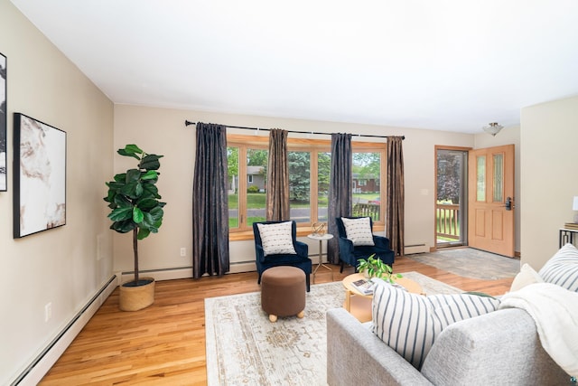 318 Marshall St, Duluth, MN 55803 - living room featuring a baseboard heating unit and light wood-style flooring