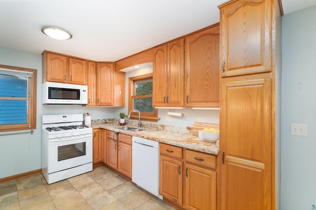 318 Marshall St, Duluth, MN 55803 - kitchen featuring white appliances and light stone countertops