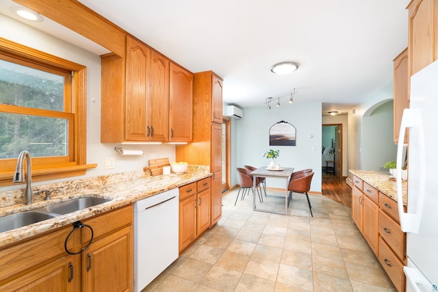 318 Marshall St, Duluth, MN 55803 - kitchen featuring white appliances, a wall mounted AC, light stone countertops, arched walkways, and light tile patterned floors