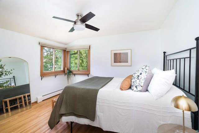 318 Marshall St, Duluth, MN 55803 - bedroom featuring a baseboard heating unit, wood finished floors, ceiling fan, and vaulted ceiling