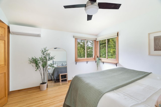 318 Marshall St, Duluth, MN 55803 - bedroom with a wall mounted AC, light wood-style floors, ceiling fan, and vaulted ceiling