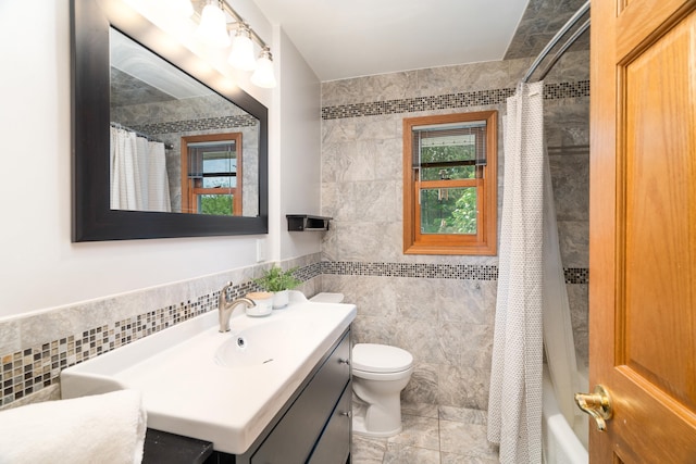 318 Marshall St, Duluth, MN 55803 - full bathroom with tile walls, vanity, shower / bath combo, and wainscoting