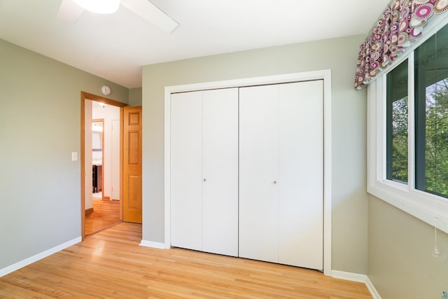 318 Marshall St, Duluth, MN 55803 - unfurnished bedroom featuring light wood-style floors, a closet, and ceiling fan