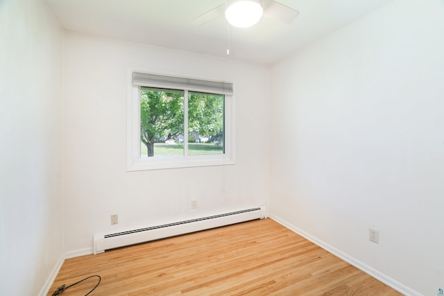 318 Marshall St, Duluth, MN 55803 - spare room with baseboard heating, light wood-style floors, and ceiling fan